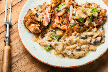 Turkey schnitzel with fried mushrooms