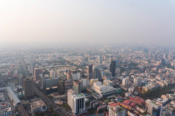Fototapeta na wymiar Landscape of the top view Bangkok metropolis Thailand with the dirty clouds air pollution problem. the tower and building in business area