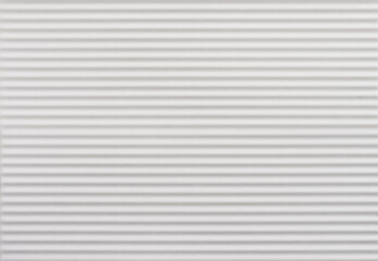 White ceramic tile with corrugated design. For using as background and texture.