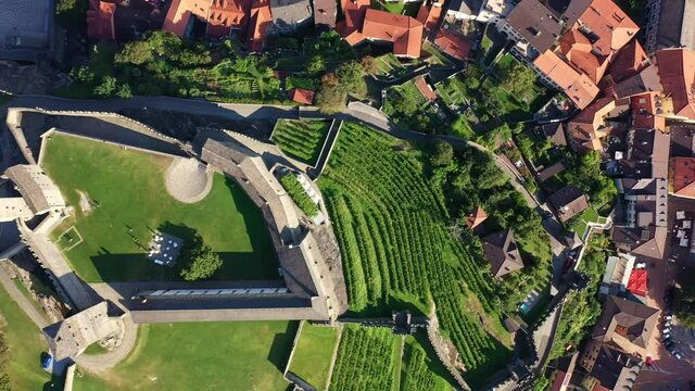 Overhead aerial drone footage of the Bellinzona old town and the grand Castle in Canton Ticino in Switzerland. 