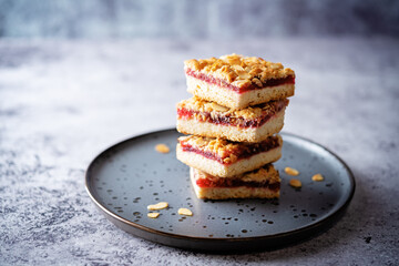 Sweet shortbread cookies with berry jam in a plate