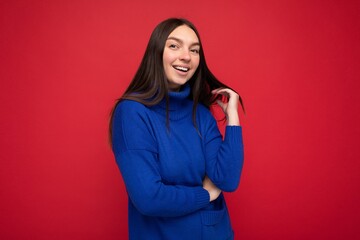 Fototapeta premium Photo of beautiful positive smiling adult woman wearing stylish clothes standing isolated on colorful background with copy space looking at camera