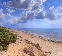 The most beautiful beaches of Italy: Campomarino dune park in Apulia, Italy. The protected area extends along the entire coast of the town of Maruggio.	
