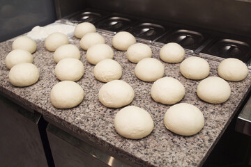 Dough. Bread dough. Fresh raw dough preparation. There are many round dough cookies on the table
