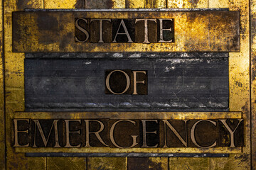 State of Emergency text on textured grunge copper and vintage gold background