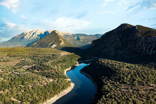 View from above, stunning aerial view of the Cedrino Lake - Lago del Cedrino, surrounded by the mountain range of Supramonte located northeast of the Gennargentu massif. Sardinia, Italy.