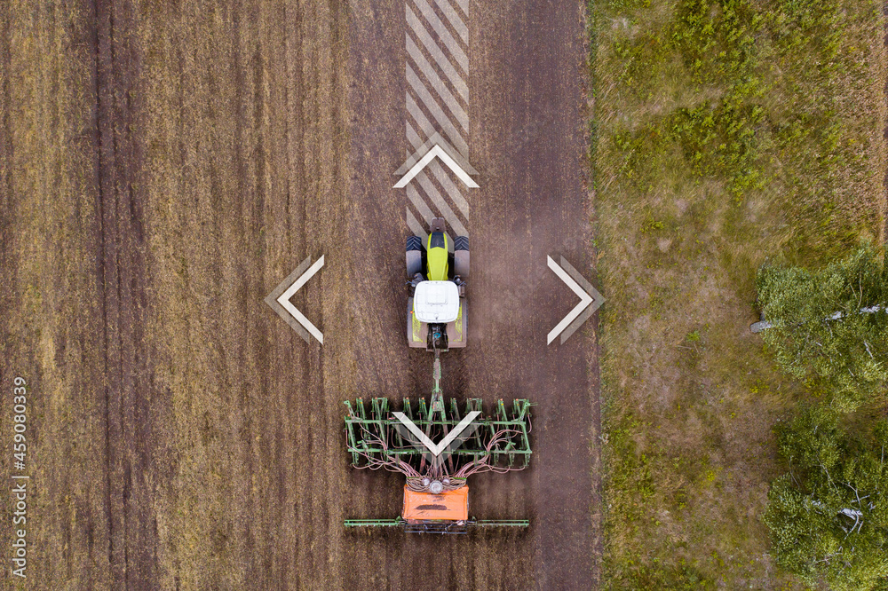 Poster autonomous tractor on the field. digital transformation in agriculture