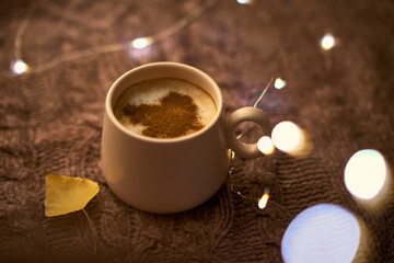 Obraz na płótnie Canvas Cup of hot coffee on rustic table