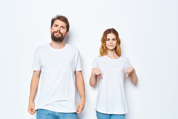 young couple in white t-shirts and jeans Friendship on emotions mockup