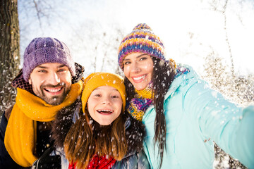 Photo of excited lovely family do selfie wear winter cloth outside walk in park