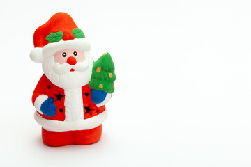 Fototapeta na wymiar Little Santa Claus toy isolated on white background. christmas and new year concept