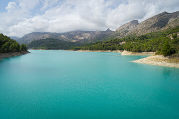 Fototapeta premium turquoise blue water of the Guadalest lake in the mountains travel and relaxation background
