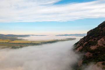Foggy morning over the Danube river in Hugary. This photo made in Danube bend near by Esztergom city. Amazing landscape with haze.