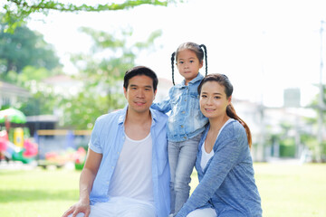Obraz premium Happy asian family together with daughter in park
