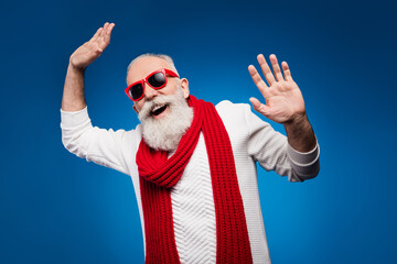 Photo of attractive pretty age gentleman wear white sweater red eyewear smiling dancing isolated blue color background