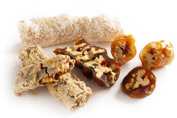 Walnuts on a string dipped in starch grape molasses. Churchkhela. Walnut sujuk.