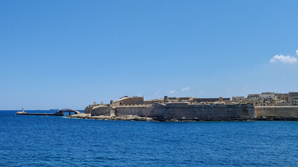 At the tip of Valletta, Malta is Fort Saint Elmo, the Valletta Breakwater lighthouse and the Saint. Elmo Bridge.