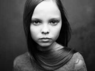 Fototapeta premium girl with sad expression close-up cropped view