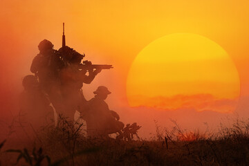 The silhouette of a military soldier with the sun as a Marine Corps for military operations - 459101135