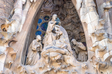 Detail of the coronation of the Virgin Mary in the facade of sacred family 