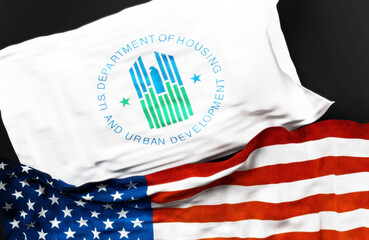 Flag of the United States Department of Housing and Urban Development along with a flag of the United States of America as a symbol of a connection between them, 3d illustration
