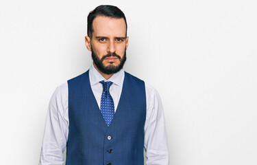 Young man with beard wearing business vest skeptic and nervous, frowning upset because of problem....