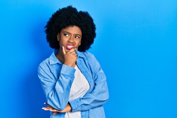 Fototapeta na wymiar Young african american woman wearing casual clothes thinking worried about a question, concerned and nervous with hand on chin