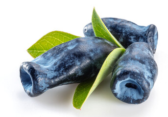 Three ripe honeysuckle berries with leaves on white background.