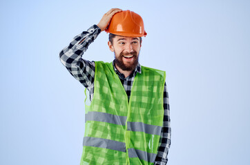 working man in orange hard hat construction professional isolated background