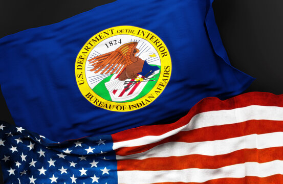 Flag of the United States Bureau of Indian Affairs along with a flag of the United States of America as a symbol of a connection between them, 3d illustration