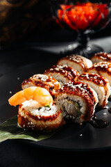 Japanese sushi rolls with salmon, shrimp, smoked eel and red caviar