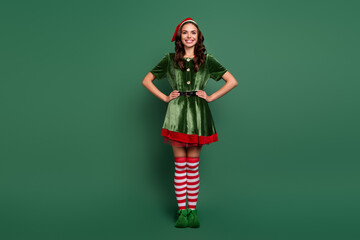 Full length body size view of attractive cheerful girl wearing elf look posing isolated over green...
