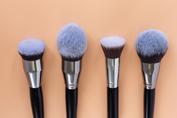 makeup brushes on colored backgrounds. View from above