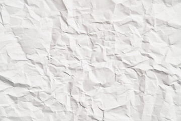 White crumpled paper texture with wrinkles. Damaged and torn sheet
