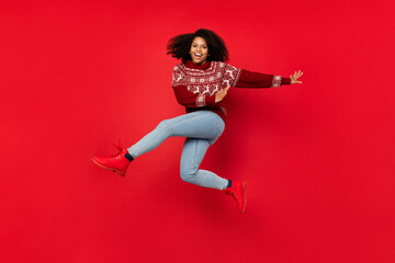 Full length body size view of attractive cheerful girl jumping having fun dancing isolated over shine red color background