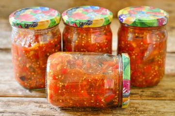 Homemade canned vegetables. Vegetable caviar in glass jars.