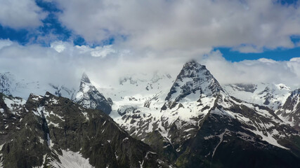 Obraz premium View from afar to the top of the mountain, clouds, majestic landscape, stock photo