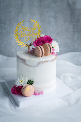 Cute Naked cakes Decorated with Macaron and rose flower on white cloth