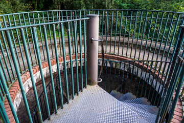 Circular start of a spiral staircase in an outdoors structure, London, England, UK