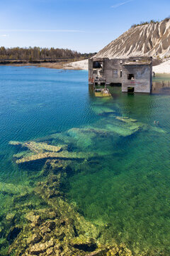 Abandoned industrial structure submerged limestone quarry in Rummu Estonia 