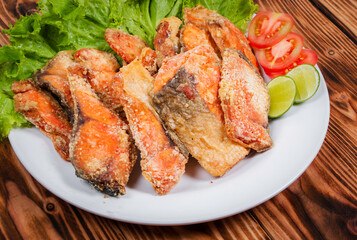close up salmon Dipped in batter and deep fried inside the dish.