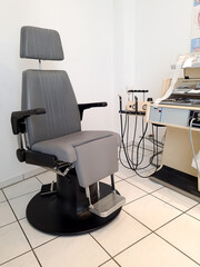 Patient examination chair in the Otolaryngologist's office. ENT office - endoscope. Vertical format.
