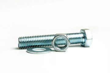 several large nuts and bolts in a group on a white background