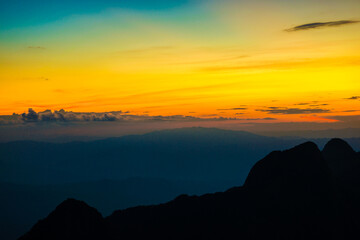 Sunset sky with cloud on top of mountain
