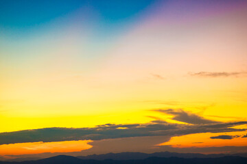 Sunset sky with cloud on top of mountain