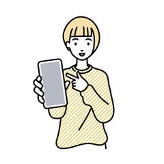 立ってスマートフォンを指差してこちらに向けて見せているリモートワークの女性