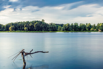 Long exposure photo of river  with rocks © Robert