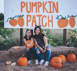picking pumpkins in a pumpkin patch at farmer mikes u pick in Bonita springs Florida Looking for a local, pumpkin patch, corn maze, hayride, gourds and other Halloween activities in Florida © Tamara Sales 