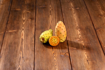 Prickly pear on wooden table.