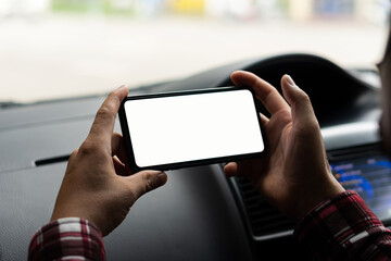 Mobile phones with white screen size driving the concept of a car to find directions with GPS.